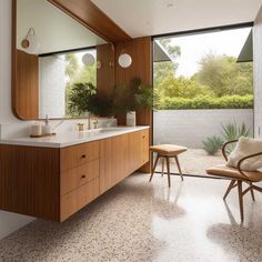 a bathroom with a large mirror and two stools