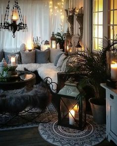 a living room filled with lots of furniture and candles