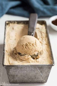 a scoop of ice cream in a metal container