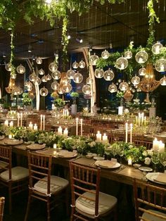 a long table is set with plates and candles