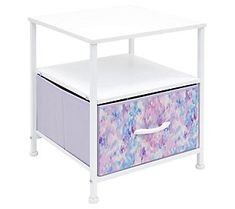 a white table with two drawers underneath it and a purple drawer under the bottom shelf