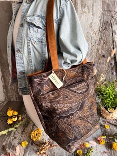 Our Chester is a faded black velvet with a rich printed design. Warm gold and brown tones mix elegance and earthy, the darker color way. The Bon Bucket has an interior zipper pocket, two large interior open pockets, and two open exterior pockets. This bag has feet, two 26" straps, two exterior pockets, and a magnetic closure. Dimension: 13.00"W x 14.00"H x 6.50"D Knitting Needle Storage, Handcrafted Handbags, Local Yarn Shop, Project Bags, Brown Tones, Hand Dyed Yarn, Medium Bags, Louis Vuitton Speedy Bag, Printed Design