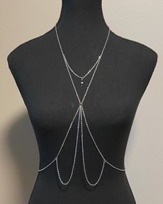 Body Chain Jewellery, handmade in steel plated white gold and accent beads. (Style name "Alexandra") one size fits most (xs-l)  Comes with an adjustable neck and waist chain. Silver Choker Body Chain, Adjustable Dangle Chain Necklace, Adjustable Gold Sterling Silver Body Jewelry, Adjustable Silver Necklace For Festivals, Adjustable Silver Waist Chain As Gift, Adjustable Silver Waist Chain For Gift, Adjustable Metal Lariat Necklace For Festivals, Silver Beaded Waist Chain For Party, Adjustable White Body Jewelry As Gift