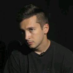 a man sitting in front of a computer keyboard