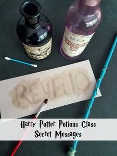 harry potter potions class secret messages are on the table next to some pens and bottles