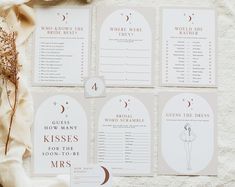 the wedding stationery is laid out on a table