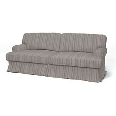 a gray couch sitting on top of a white floor