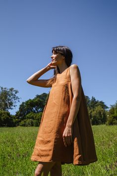 This dress is made in collaboration between World of Crow and Erica Kim. Our noon day dress, has a minimalist style. It is made with linen fabric and the colour is rustic brown. The dress is A-line with a flare at the bottom. Rustic brown Linen A-line flare Square neck Sleeveless Side pockets Straight hem Above knee length Fabric feels slightly thick Size & Fit Length 36" Fits true to size Close fit over the bust with a relaxed fit around the body Midweight, non-stretchy fabric Marynia is wearin Erica Kim, Black Aviators, Rustic Brown, Mid Dresses, Mens Accessories Fashion, Day Dress, Ruched Dress, Shirt Skirt, New Arrival Dress