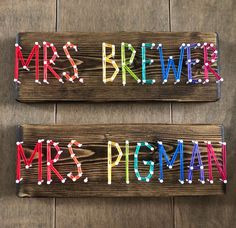 two wooden signs with the words mr and mrs pegman written on them in different colors