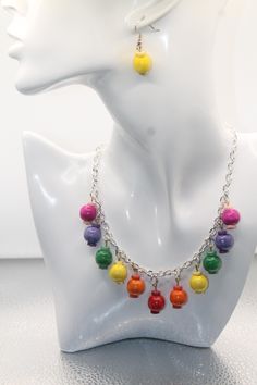 This is a beautiful handmade dangling rainbow charm necklace earring set. It has an adjustable chain to fit your size. Measures 19". Earrings are two different colors with hooks. Colorful Adjustable Chain Jewelry Gift, Colorful Adjustable Chain Jewelry As Gift, Colorful Jewelry With Adjustable Chain For Gifts, Colorful Jewelry With Adjustable Chain As Gift, Dangling Bead Jewelry Sets As Gifts, Multicolor Dangle Jewelry With Lobster Clasp, Dangling Beads Jewelry Set As A Gift, Dangle Jewelry Sets With Dangling Beads As Gift, Adjustable Multicolor Dangle Jewelry