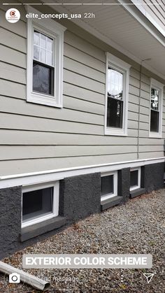 an exterior color scheme for a house with gray siding and white trim on the windows