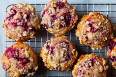 muffins cooling on a wire rack with cranberries