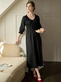 This product showcases an elegant shirring design that flatters the figure. It embraces a classic aesthetic with its puff sleeves and mid-calf length. The square neckline adds a touch of sophistication, making it versatile for various occasions. - This shirring dress features a fitted bodice created by delicate gathers that provide both form and comfort.- The puff sleeves and square neckline come together to create a romantically feminine silhouette.- Its mid-calf length ensures this dress is suitable for a range of settings, from daytime events to more formal gatherings.- A handmade Cali medal decoration is subtly affixed to the lower right front panel, offering a unique and artisanal embellishment. Elegant Puff Sleeve Dress With Smocked Bodice And V-neck, Elegant Midi Dress With Smocked Bodice And Empire Waist, Elegant Midi Dress With Square Neck And Elastic Sleeves, Elegant Square Neck Midi Dress With Elastic Sleeves, Elegant Puff Sleeve Dress With Gathered Waist, Chic Midi Dress With Gathered Waist And Square Neck, Solid Color Ruched Midi Dress With Empire Waist, Elegant Midi Dress With Gathered Waist For Brunch, Chic Midi Dress With Square Neck And Gathered Waist