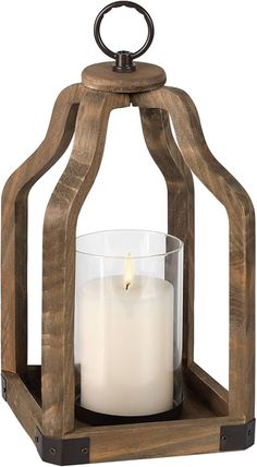 a wooden lantern with a lit candle inside and an iron ring around the top, on a white background