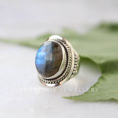 Natural labradorite ring, Sterling Silver ring, cocktail ring, alternative engagement ring, labradorite jewelry, 925 Silver jewellery, boho jewelry Description: I make the gemstones myself for my valued customers so I assure you that the gemstones are NATURAL and are made from ETHICALLY SOURCED ROUGHS. The rest of the ring is made from 925 STERLING SILVER i.e 92.5% PURE SILVER. And it doesn't have any lead or nickel. The gemstone used is a lovely oval shaped, 12*16 mm (millimeters) The pictures Bohemian Labradorite Jewelry Stamped 925, Bohemian Oval Labradorite Rings, Silver Bohemian Labradorite Ring, Silver Labradorite Bohemian Ring, Bohemian Silver Labradorite Ring, Bohemian Labradorite Gemstone Ring, Alternative Engagement Ring, Labradorite Bracelet, Rainbow Moonstone Ring