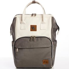 a gray and white backpack with brown straps on the front, sitting against a white background