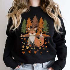 Cute fox tree leaves sweatshirt is a great addition to any nature lovers and fox lover's wardrobe this season. Beautiful fall scene and fox makes this sweat shirt truly adorable to wear on any occasion. This vintage cottagecore sweater makes a great gift for mom, gift for grandma, gift for a friend, gift for a daughter, gift for nature lover, gift for fox lovers, fall gifts.  OUR ADULT SWEATSHIRTS Our designs are printed on a heavy blend crewneck unisex sweatshirt made out of a combination of 50 Cottagecore Sweater, Cozy Sweaters Autumn, Fox Animal, Animal Sweater, Fox Shirt, Fox Lover, Sweater Autumn, Pet Fox, Woodland Forest