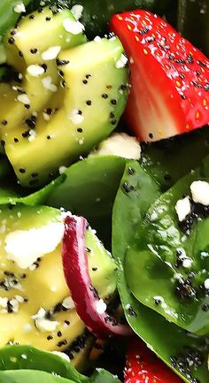 a close up view of some vegetables with pepper and other things on them, including strawberries