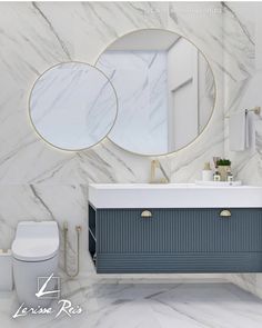 a bathroom with marble walls and flooring, two round mirrors on the wall above the sink