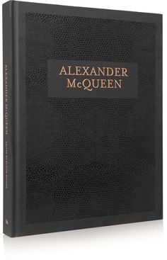 a black book with gold lettering that reads, alexandria mcquen on the cover