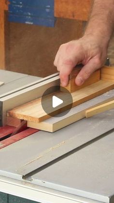 a person using a table saw to cut wood