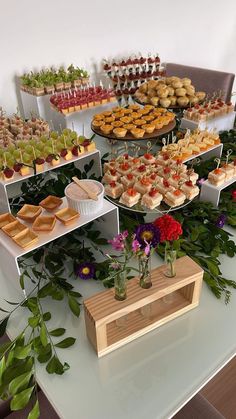 a table topped with lots of desserts and pastries