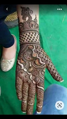 a person with henna on their hand