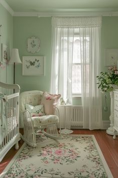 a baby's room is decorated in pastel green and pinks with white trim