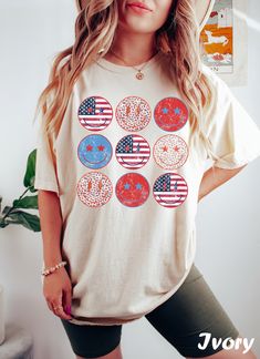 Smiley 4th of July Shirt ❤️ Every shirt is hand printed to order, we put so much love into making each shirt  ❤️ If for any reason the shirt didn't live up to your quality standards, contact us and we'll replace it or refund it ❤️ Feel free to send us your special request or if you have a unique idea for a shirt So it's that time again. You need to look for a new T-shirt to wear with your favorite jeans... for that effortless look 😥 You know, the kind that says I woke up like this but takes an Patriotic Summer T-shirt With Custom Print, American Flag Print Graphic Tee With Relaxed Fit, American Flag Print Relaxed Fit Graphic Tee, Independence Day Funny Print Short Sleeve T-shirt, 4th Of July Relaxed Fit Screen Print T-shirt, Relaxed Fit Screen Print T-shirt For 4th Of July, 4th Of July Cotton Tops With Screen Print, Relaxed Fit Screen Print Top For 4th Of July, Independence Day Graphic Tee Shirt With Relaxed Fit