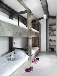 there is a bunk bed in the room with shoes on the floor next to it