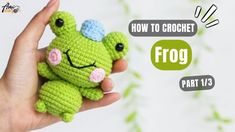 a hand holding a small crocheted frog with the words how to crochet on it