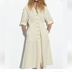 Midi Dress With Folded Elbow-Leght Sleeves. V-Neckline A-Line Silhouette Skirt With Side Pockets, Pleading Detail, Front Button Closure 100% Cotton Pit To Pit 21" Length 51" Zara V-neck Shirt Dress For Work, Collared Beige Midi Dress For Office, Office Wear Beige V-neck Midi Dress, Beige V-neck Midi Dress For Office, Office Beige V-neck Midi Dress, Elegant Beige Button-up Midi Dress, Zara V-neck Midi Dress For Office, Summer Cream Shirt Dress For Work, Cream Collared Dress For Work