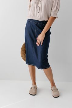 With the look of real denim but the feel of a quality knit, comfort is the key element in our exclusively designed 'Piper 'Skirt. The quick, pull on style with a fabric covered waistband makes this skirt a practical everyday option! Soft, comfortable knit denim fabric Functional Back Pockets 70% Rayon 25% Polyester 5% Spandex Wash Cold Gentle Cycle Hang to Dry Fabric covered elastic waistband Model A Height in Dark Blue 5'5" | Wearing Size Small Wearing 'Finch' Smocked Yoke Cotton Gingham Top in Gingham Top, Knit Denim, Gingham Tops, Knit Skirt, Main Street, Denim Fabric, Fabric Covered, Soft Knits, Chambray