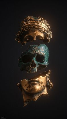 three gold and green masks are stacked on top of each other in the shape of a skull