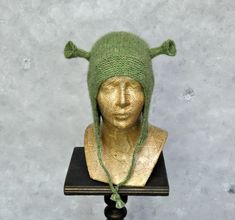 Winter hat, Knit hat, Alpaca beanie hat, Ogre hat gift for men, Shrek costume hat, Christmas gift for women More animal hats you can find here: https://etsy.me/3B4ySGh This lovely Shrek inspire hat might be the perfect gift for your friends. This bonnet hat with ears is hand-knitted. It's made of very soft yarn -blow yarn, made of baby alpaca wool with the addition of polyamide. Adding polyamide to the yarns makes them more durable, and the knitted fabrics hold their shape better. The hat is soft and warm. It will protect you before the winter chill. One size. Color: green. Because of different monitors and screen resolutions, color may look different on the screen than in reality. If you want such a hat in any other color please feel free to contact me. I will be happy to make it for you. Alpaca Beanie, Shrek Costume, Hat With Ears, Hat Knit, Animal Hats, Knitted Animals, Bonnet Hat, Quality Hats, Ear Hats