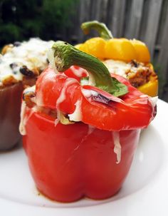 three different types of stuffed peppers on a white plate