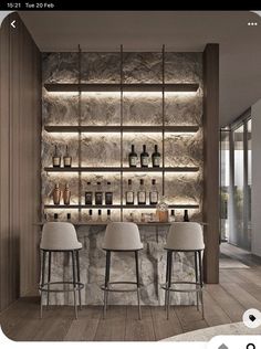 an image of a bar with stools and bottles on the shelves in front of it