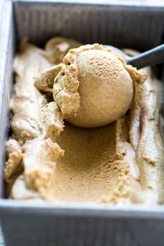 a scoop of ice cream in a metal container