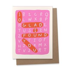 a greeting card with an orange and pink alphabet on the front, in white paper