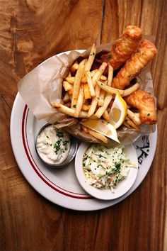 fish and fries are served on a plate