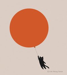 a black cat flying through the air with an orange balloon