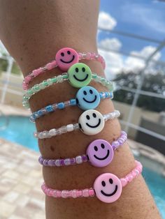 Hand-made in sunny Florida! The goal of these colorful bracelets is to make you smile and brighten your day when you look at them! Surprise your daughter, friend, Mom, etc. with this feel good bracelet! It comes in the following colors - purple, green, blue, pink (light pink smiley or dark pink smiley), & white. Smiley Face Bracelets, Cheerful Adjustable Multicolor Friendship Bracelets, Cheerful Multicolor Adjustable Friendship Bracelets, Cheerful Adjustable Friendship Bracelets As Gift, Adjustable Fun Friendship Bracelets For Festivals, Cheerful Adjustable Jewelry For Friendship, Fun Adjustable Friendship Bracelets With Colorful Beads, Colorful Fun Friendship Bracelets, Casual Rainbow Beaded Bracelets For Friendship