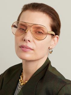 Bottega Veneta Eyewear's 'Sardine' sunglasses are named for their sleek, sculptural arms. Made in Japan from gold-tone metal, this aviator-style pair is fitted with subtly tinted lenses and engraved with the brand name across the top of the brow bar. Tinted Glasses, Aviator Glasses, Brow Bar, Aviator Style, Fine Watches, Eyewear Womens, Gold Sunglasses, Eyewear Accessories, Aviator Sunglasses