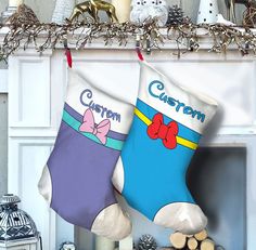 two christmas stockings hanging from a mantel