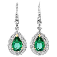 Drop Earrings with Pear Shape Emeralds and diamonds Mounted in 18K White & Yellow Gold with 3 row pave halo around Emeralds and Diamond gallery on the back Each stone is 3.48ct Natural Green Emerald Pear Shape , originated in Africa Total carat weight of diamonds: 2.05ct Retail Value: 50,000$ Comes with box, appraisal available upon request Emerald Earrings Drop, Gold For Sale, Jewelry Auction, Fabulous Jewelry, Tennis Bracelet Diamond, Green Emerald, Diamond Drop Earrings, Diamond Pendant Necklace, Dream Jewelry