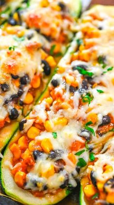 zucchini stuffed with black olives, corn and cheese