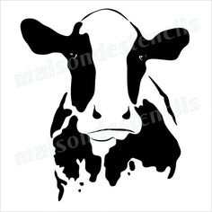 a black and white cow's face is shown