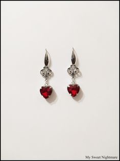 "◆ Earrings with ruby red crystal in 316 steel The red heart measures only 0,472441 inches! The whole jewel is made of 316 stainless steel, commonly called surgical steel and it is the \"purest\" steel on the market, a very corrosion resistant metal completely hypoallergenic and does not darken over time. The earrings are 1.9685 inches long ♡ In my shop there are many handmade jewels for all tastes, come and look at them you are welcome! ♡ ❤ Do you need a custom order? ❤ You can enter a free not Red Heart Earrings Aesthetic, Red Earrings For Prom, Red Silver Earrings, Red Crystal Earrings, Red Drop Earrings, Red Heart Dangle Earrings, Black And Red Jewelry, Dark Red Jewelry, Black And Red Earrings