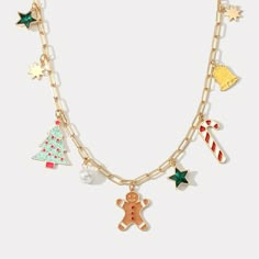 Celebrate the holidays with this festive Christmas Tree Gingerbread Man Necklace. This delicious-looking necklace features a gingerbread man hanging from a tree, making a perfect addition to any holiday ensemble. Spread the Christmas cheer with this fun and quirky accessory! DETAILS Plating: 18K Gold Materials: 18K Gold on Brass, Dripping oil,  Imitation Pearl, Zircon Measurements :   Length: 15.75"(40cm) + Extender: 1.97"(5.0cm) Weight: 21g Christmas Jewerly, Christmas Tree Gingerbread, Burr Basket, Man Necklace, Unique Gift Wrapping, Christmas Necklace, Butterfly Gifts, Christmas Accessories, Gold Charm Necklace