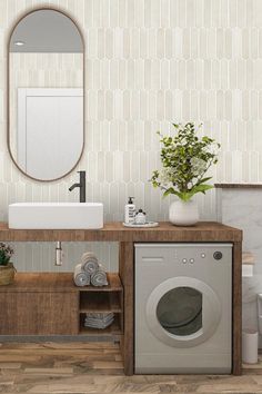 a washer and dryer in a bathroom with a mirror on the wall above it